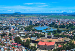 Image showing of Antananarivo, showing the Lake Anosy at the center of the image with the political center of Madagascar in the background. In the foreground is the national stadium of Madagascar.