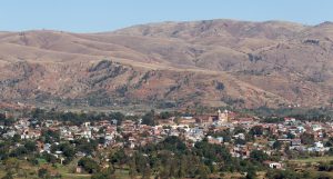 Image shows the cityscape of Antsirabe with hills in the background